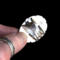 holding bottom view, large oval wild horse magnesite gemstone silver statement ring, bezel set with stamped cutout wire accent